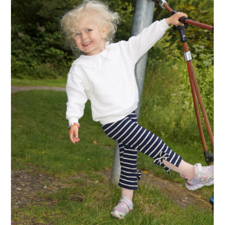 3/4 lange leggings med åbning nederst på benene dekoreret med sløjfer.